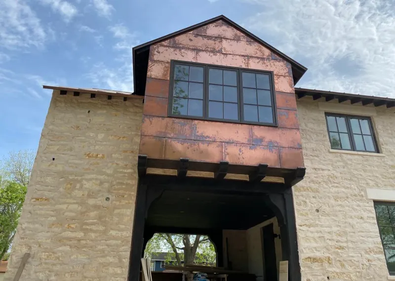 Copper metal panel facade on a stone building for Skylight Installation in Hillsborough